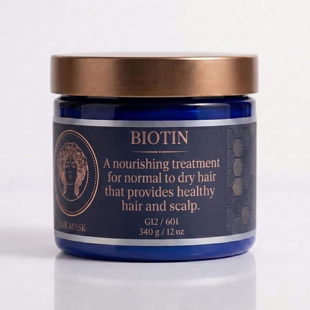 A blue jar of Biotin Hair Mask with a metallic bronze lid, set against a clean white background with a soft reflection.